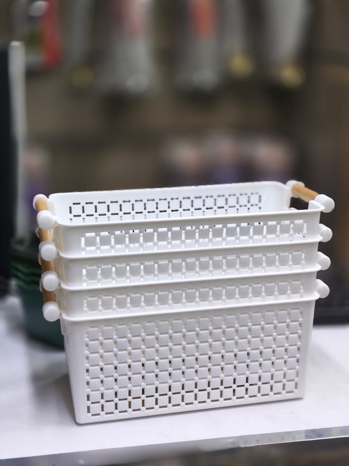 Storage basket with wooden handle